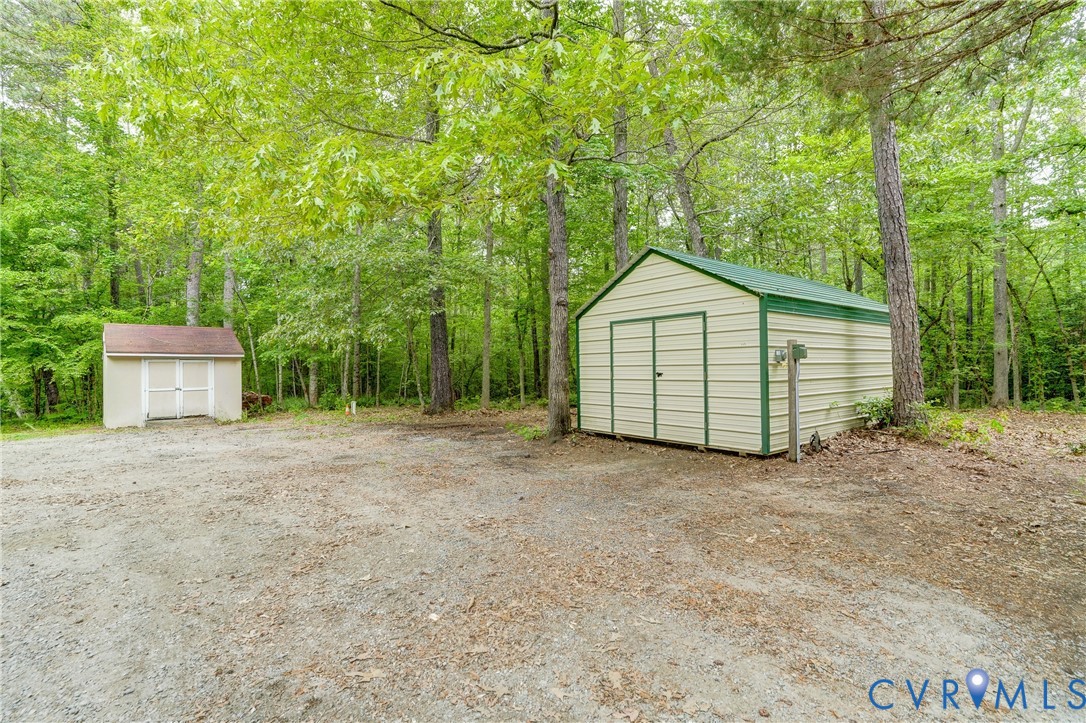 3820 Mt Pleasant Road Providence Forge, VA 23140 - Photo 33 of 40 a view of a house with a yard and large trees