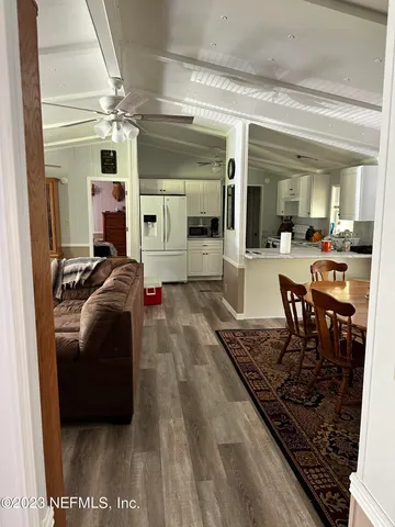 a living room with furniture and a rug