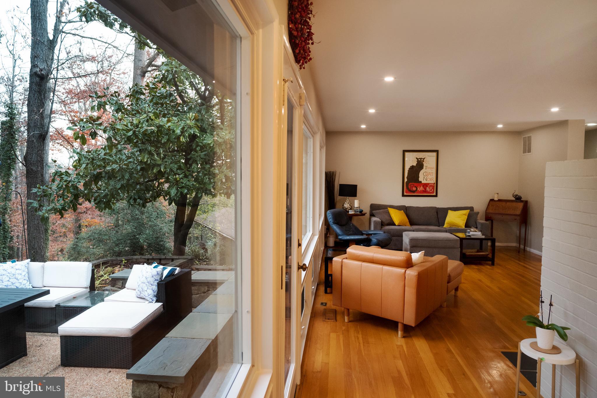 3114 Cunningham Drive Alexandria, VA 22309 - Photo 5 of 39 The living room opens to the patio, deck and yard