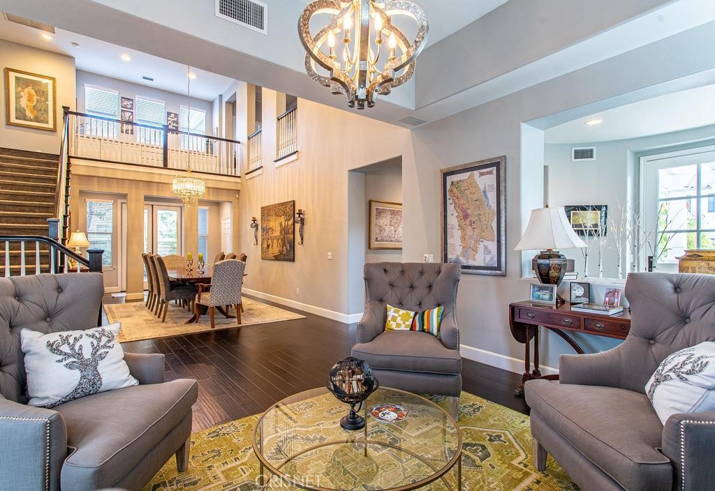 23915 Lakeside Road Valencia, CA 91355 - Photo 18 of 74 a living room with furniture or couch and a chandelier