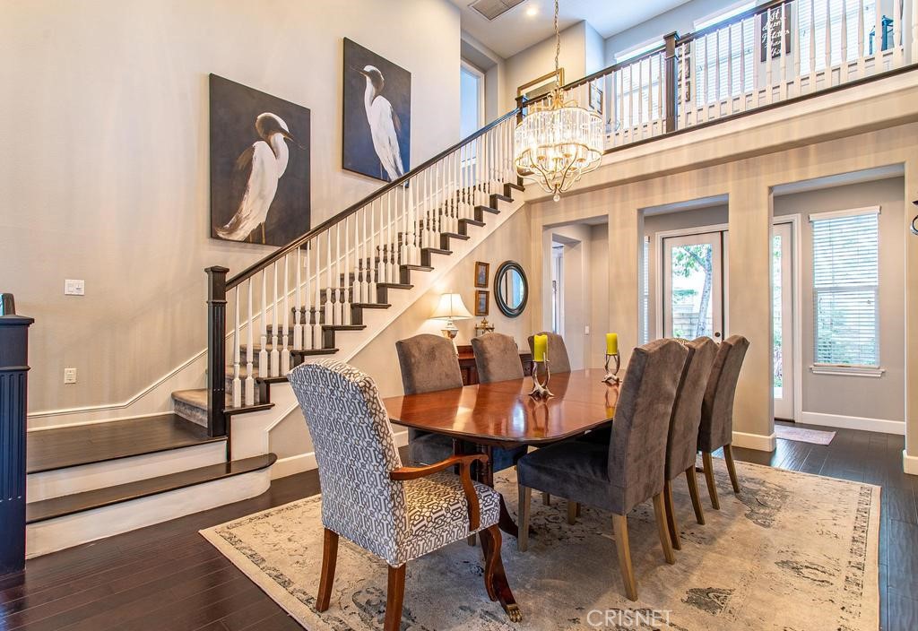 23915 Lakeside Road Valencia, CA 91355 - Photo 20 of 74 a view of a dining room with furniture window and wooden floor