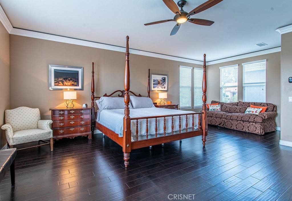 23915 Lakeside Road Valencia, CA 91355 - Photo 40 of 74 a bedroom with a bed and wooden floor