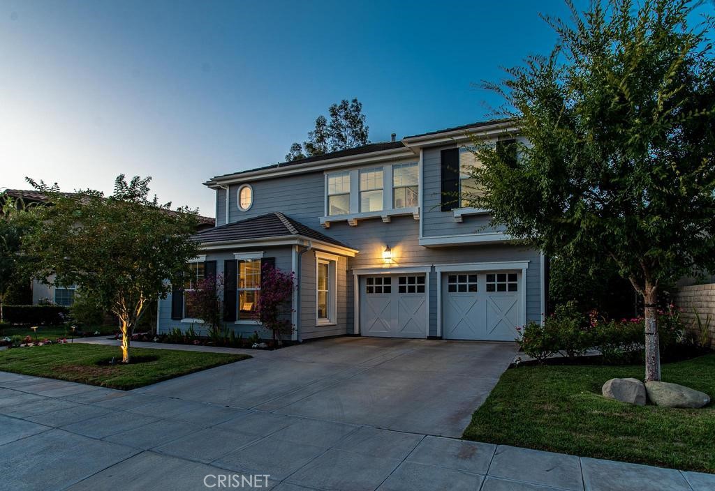 23915 Lakeside Road Valencia, CA 91355 - Photo 4 of 74 a front view of a house with garden