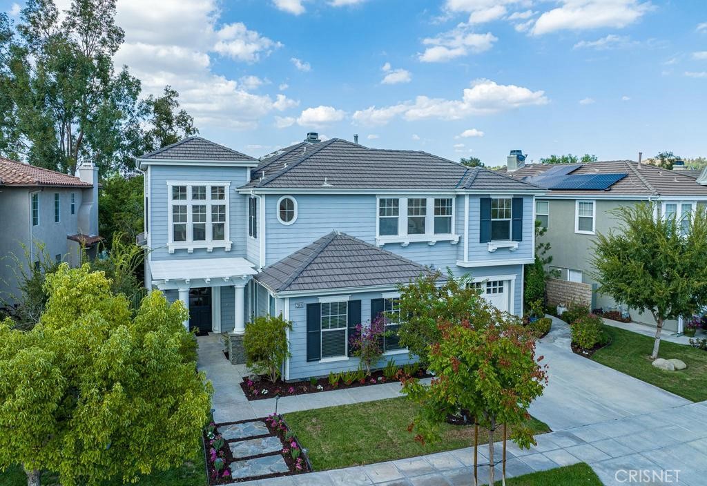 23915 Lakeside Road Valencia, CA 91355 - Photo 55 of 74 a front view of a house with a garden