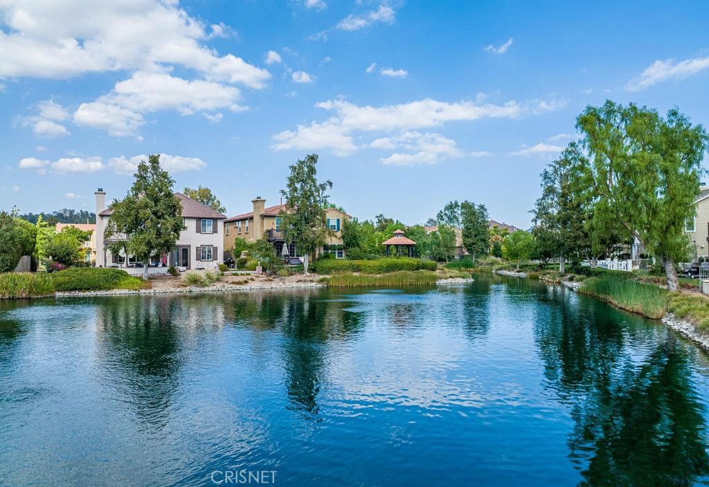 23915 Lakeside Road Valencia, CA 91355 - Photo 64 of 74 a view of a lake with a house in the background