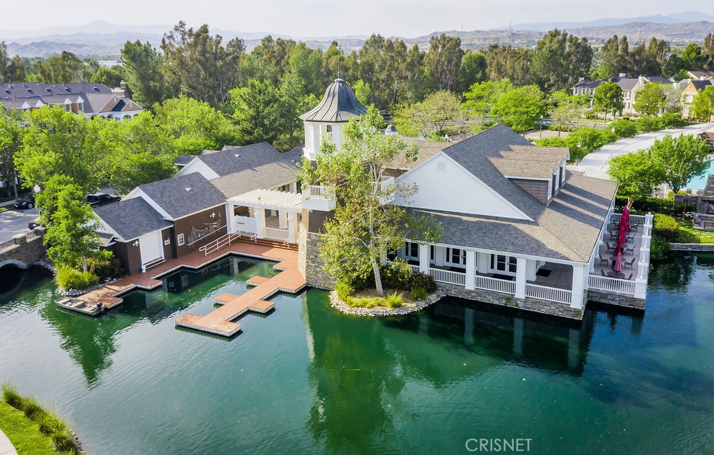 23915 Lakeside Road Valencia, CA 91355 - Photo 69 of 74 an aerial view of a house with swimming pool a yard and lake view