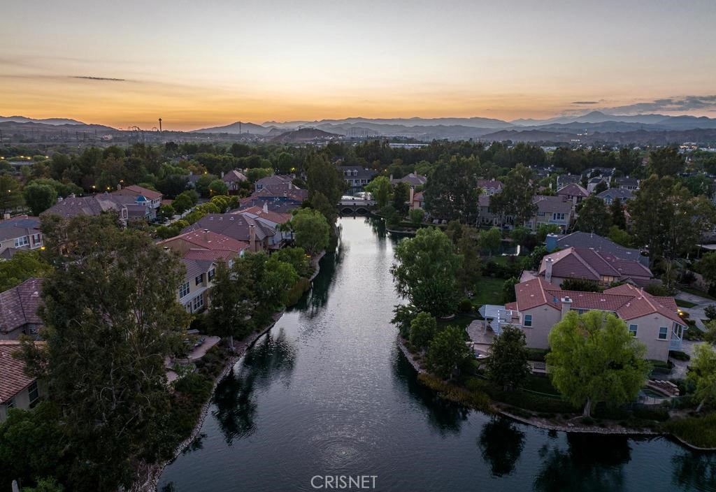 23915 Lakeside Road Valencia, CA 91355 - Photo 7 of 74 an aerial view of lake residential house with swimming pool and mountain view