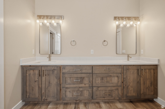 157 West 100 South Joseph, UT 84739 - Photo 18 of 30 Bathroom with double vanity and light wood finished floors