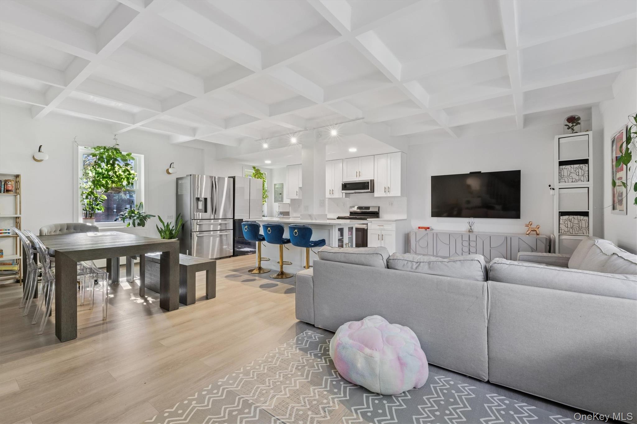 147-35 Village Road, Unit 35B Queens, NY 11435 - Photo 1 of 1 Living area featuring beamed ceiling, coffered ceiling, and light wood-style flooring