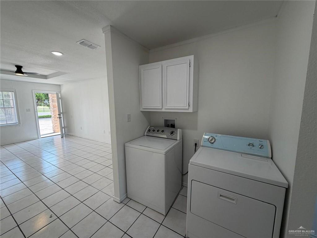 2612 West Mile 17 1/2 Road, Unit 12 Edinburg, TX 78541 - Photo 4 of 10 White cabinetry with a dual basin stainless steel sink, patterned countertop, and tiled flooring