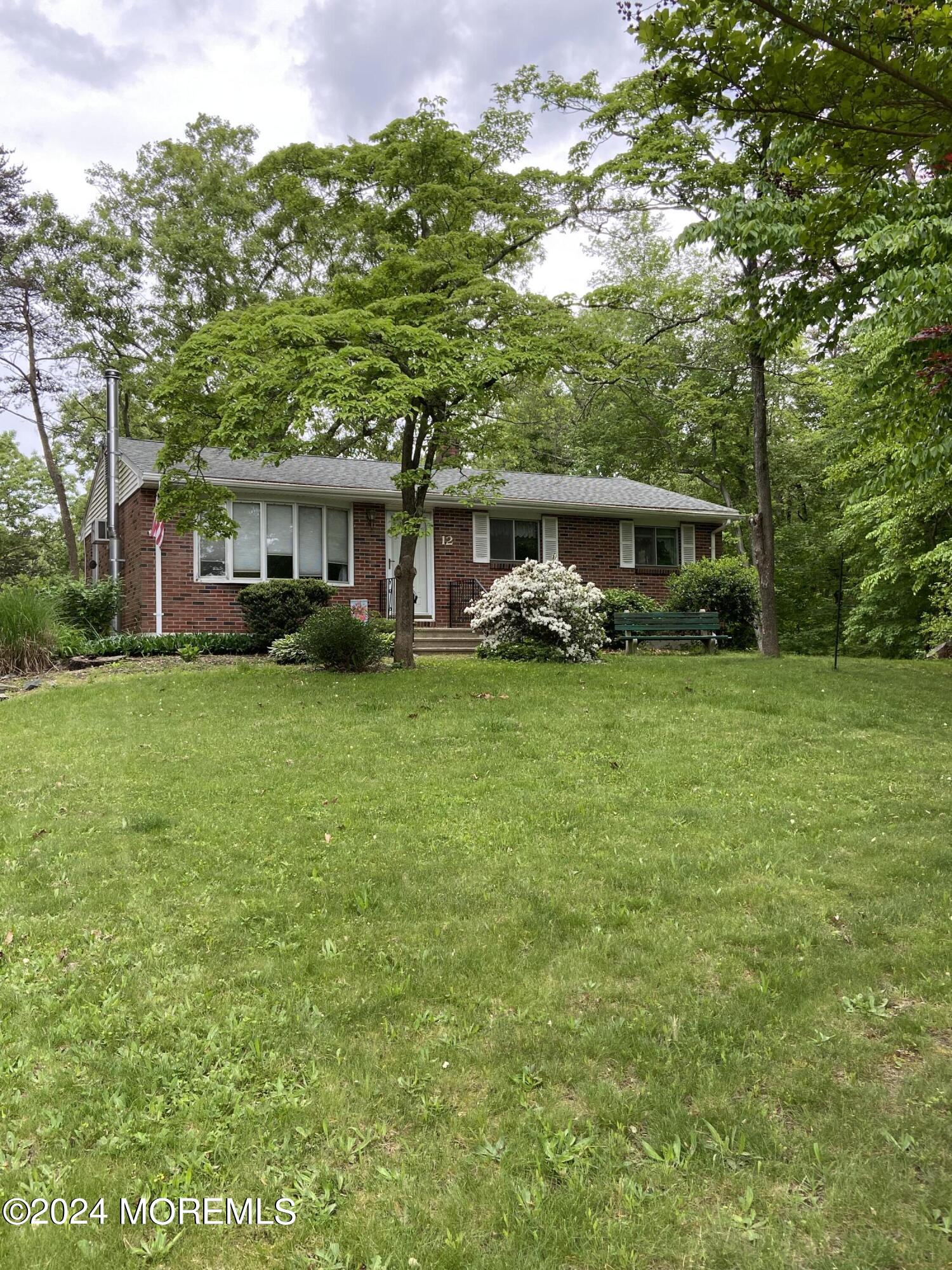 12 Main Street Cream Ridge, NJ 08514 - Photo 7 of 25 a view of a house with a big yard and large trees