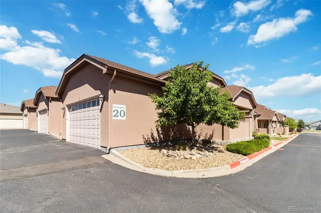 a view of a house with a small yard