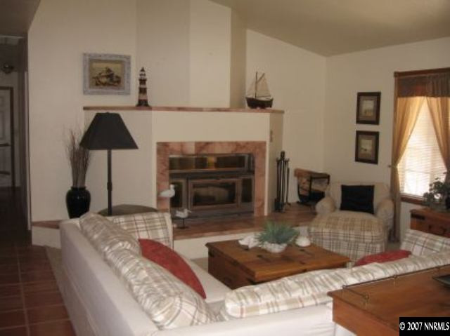 3050 Antelope Valley Road Reno, NV 89506 - Photo 2 of 5 a living room with furniture and a fireplace