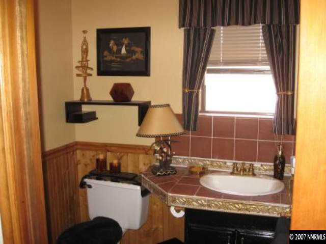 3050 Antelope Valley Road Reno, NV 89506 - Photo 4 of 5 a bathroom with a sink and a mirror