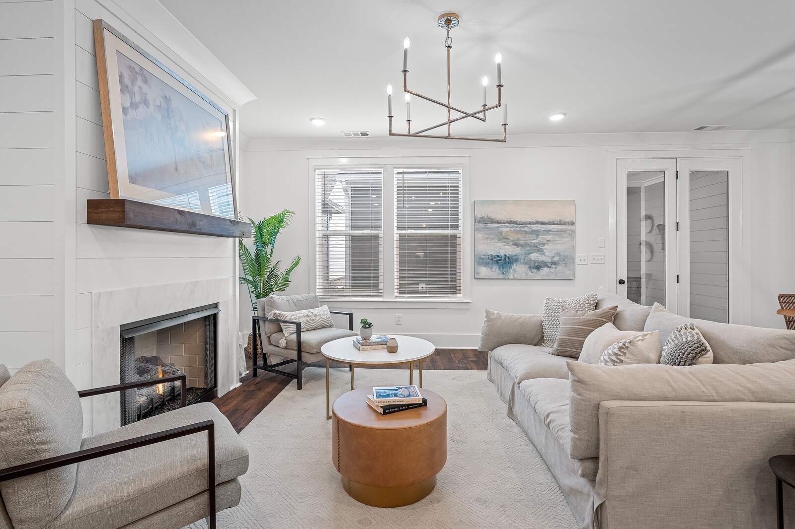 2001 Braidwood Lane Franklin, TN 37064 - Photo 13 of 35 a living room with furniture a fireplace and a chandelier