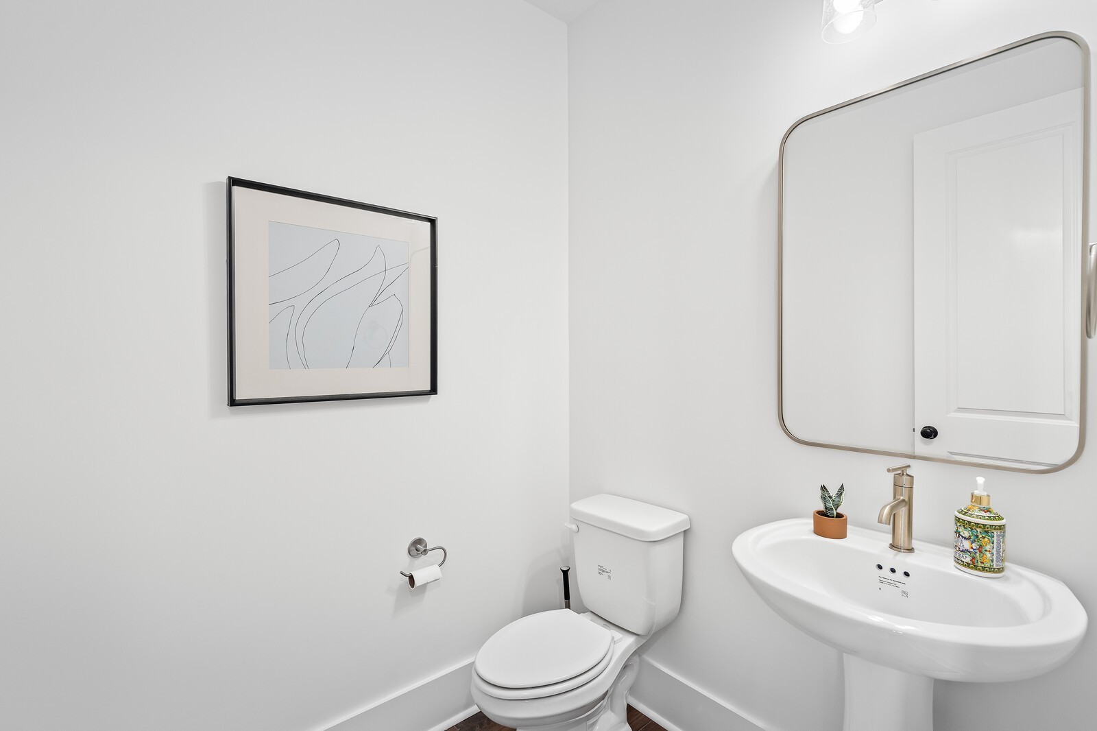 2001 Braidwood Lane Franklin, TN 37064 - Photo 17 of 35 a bathroom with a toilet a sink and mirror