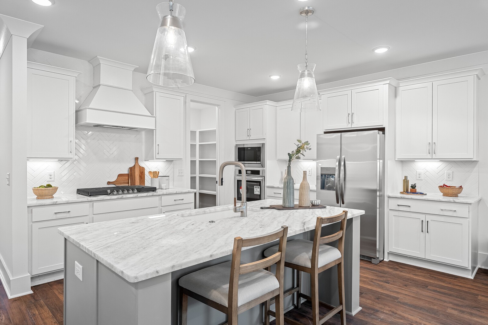 2001 Braidwood Lane Franklin, TN 37064 - Photo 9 of 35 a kitchen with stainless steel appliances granite countertop a kitchen island and chairs in it