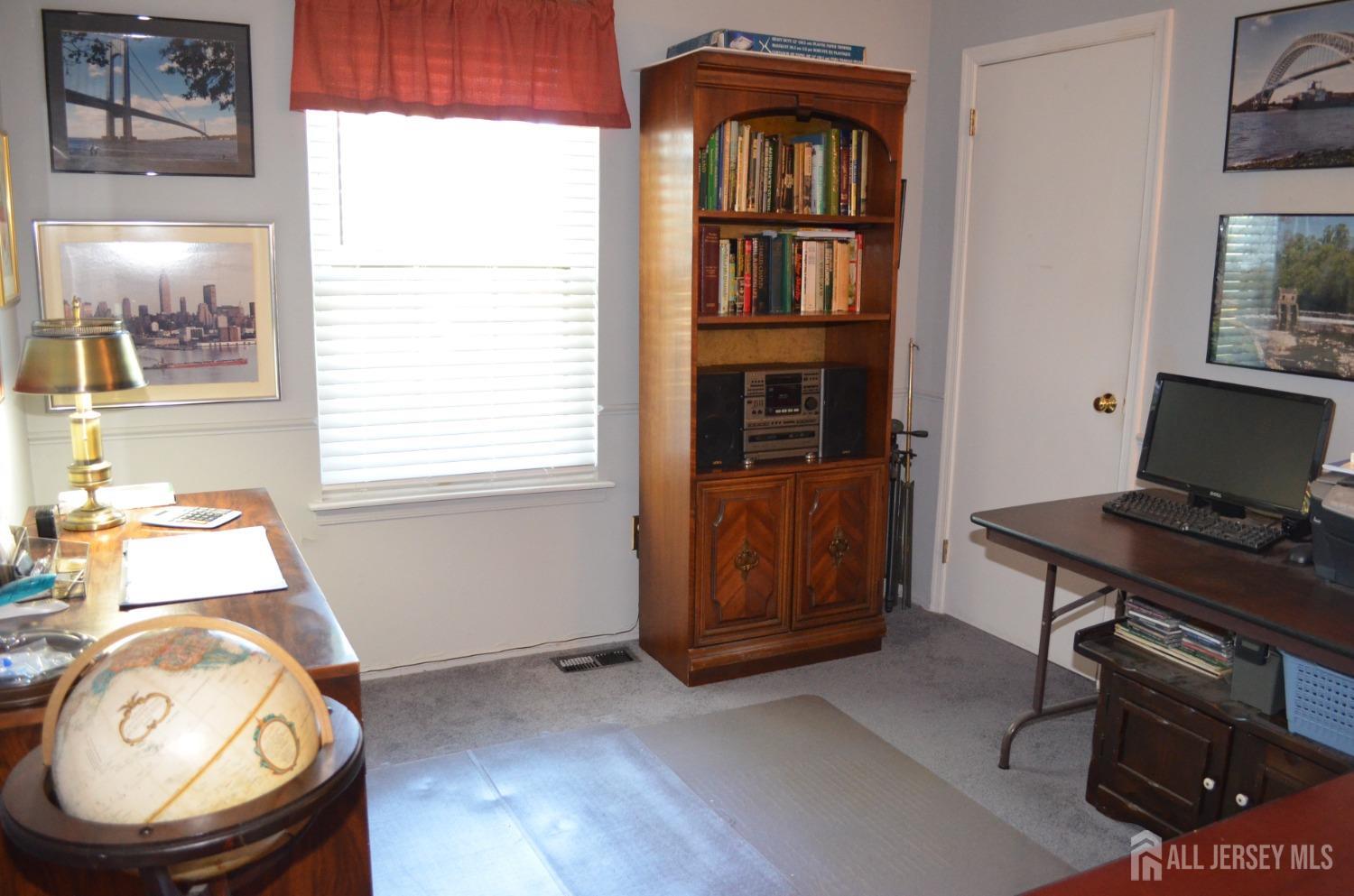 19 Foxhall Middlesex, NJ 08846 - Photo 15 of 21 a view of a workspace with furniture and a window
