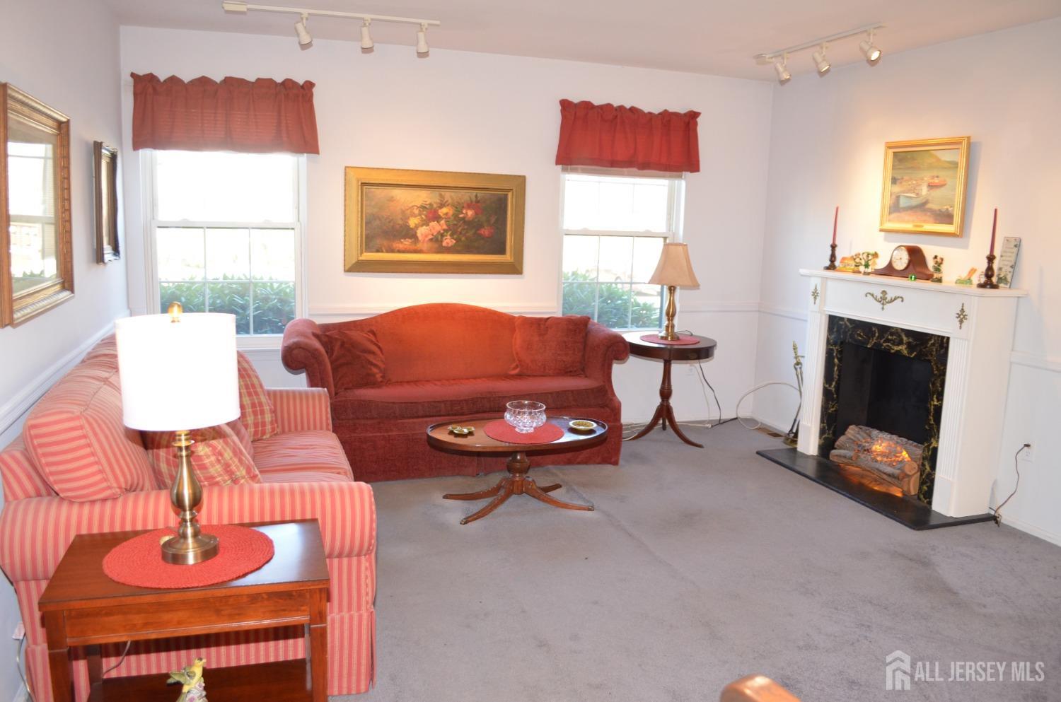 19 Foxhall Middlesex, NJ 08846 - Photo 5 of 21 a living room with furniture a window and a fireplace