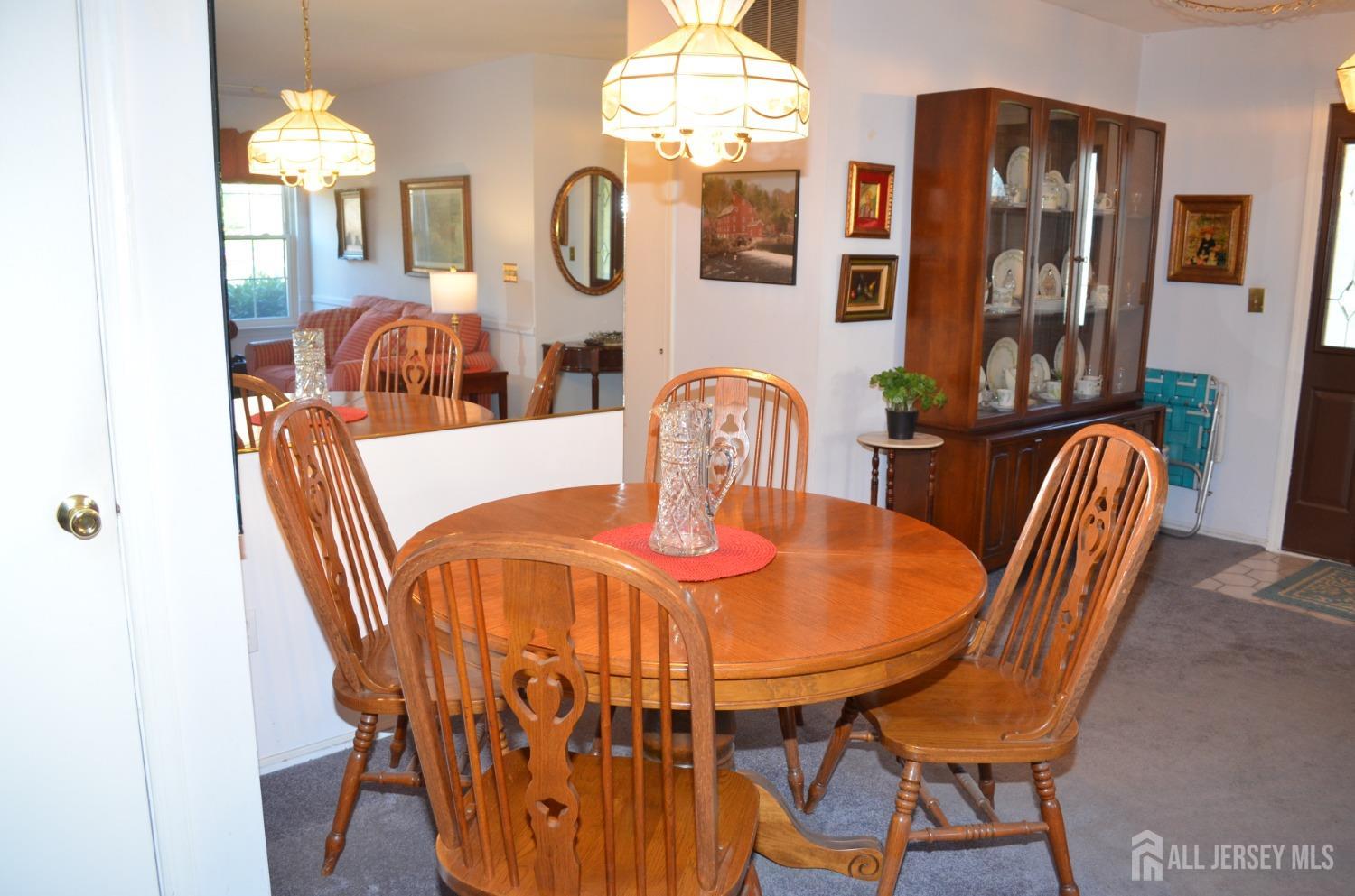 19 Foxhall Middlesex, NJ 08846 - Photo 6 of 21 a view of a dining room with furniture and chandelier