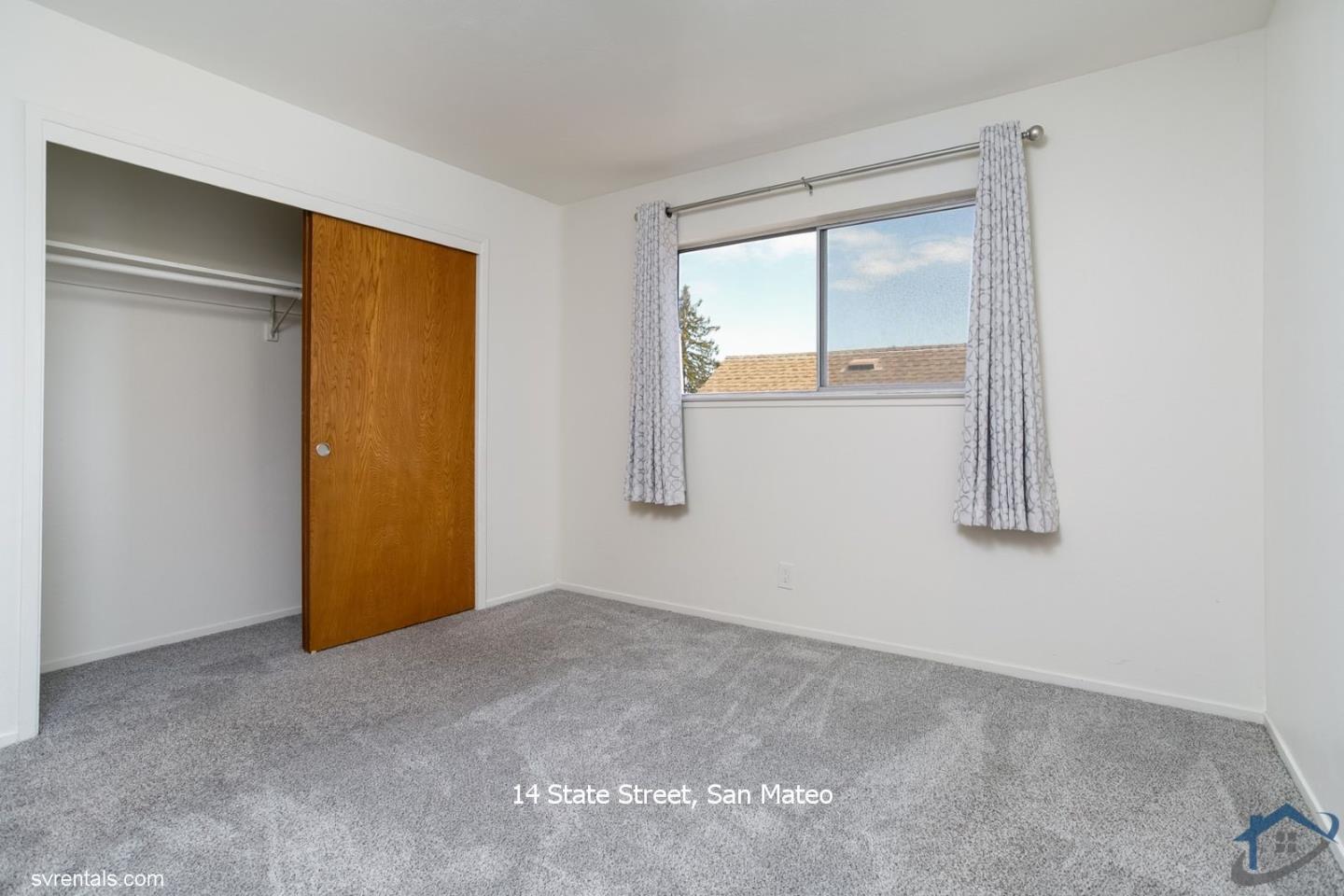 14 State Street, Unit 6 San Mateo, CA 94401 - Photo 12 of 20 an empty room with windows and closet