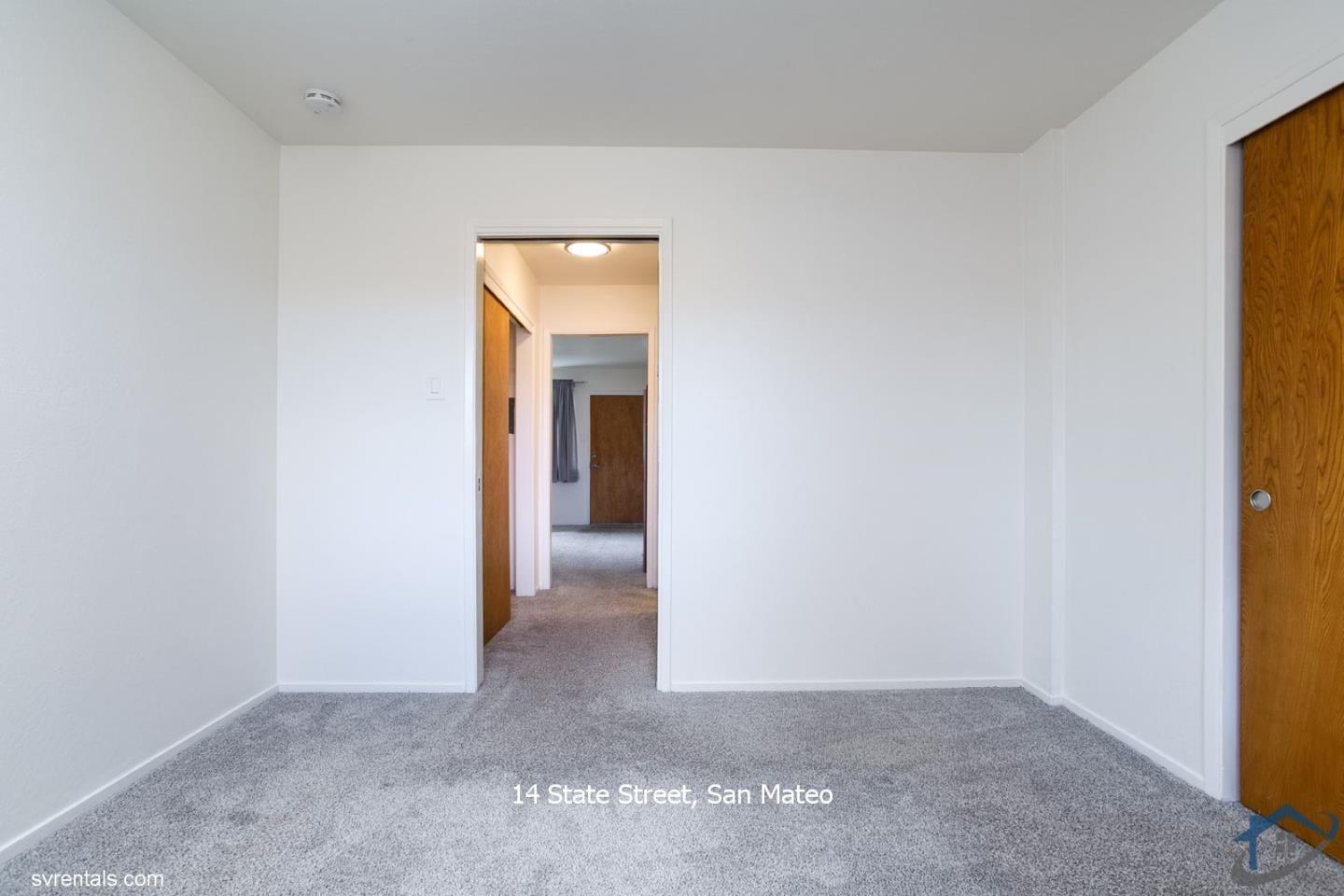 14 State Street, Unit 6 San Mateo, CA 94401 - Photo 15 of 20 a view of a hallway to rooms