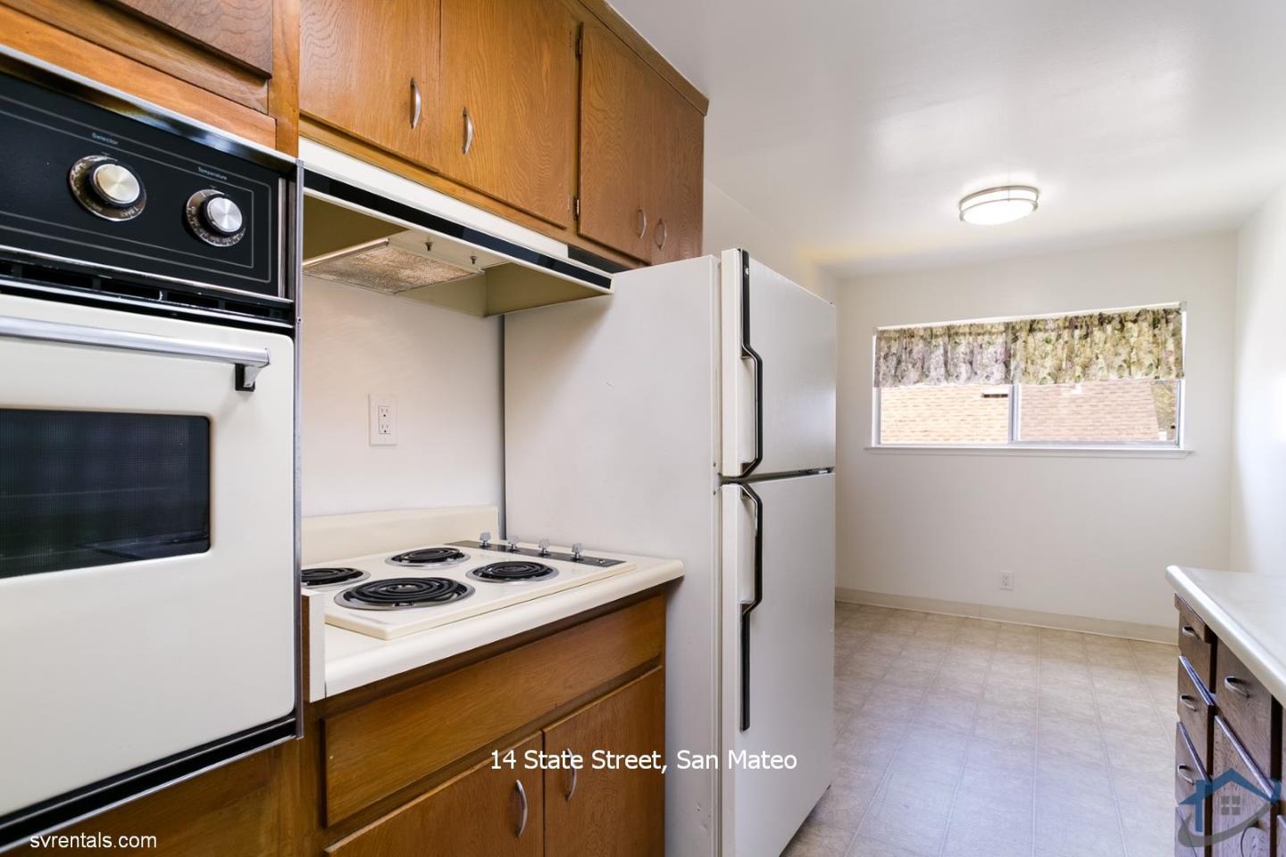 14 State Street, Unit 6 San Mateo, CA 94401 - Photo 9 of 20 a kitchen with a stove and a microwave