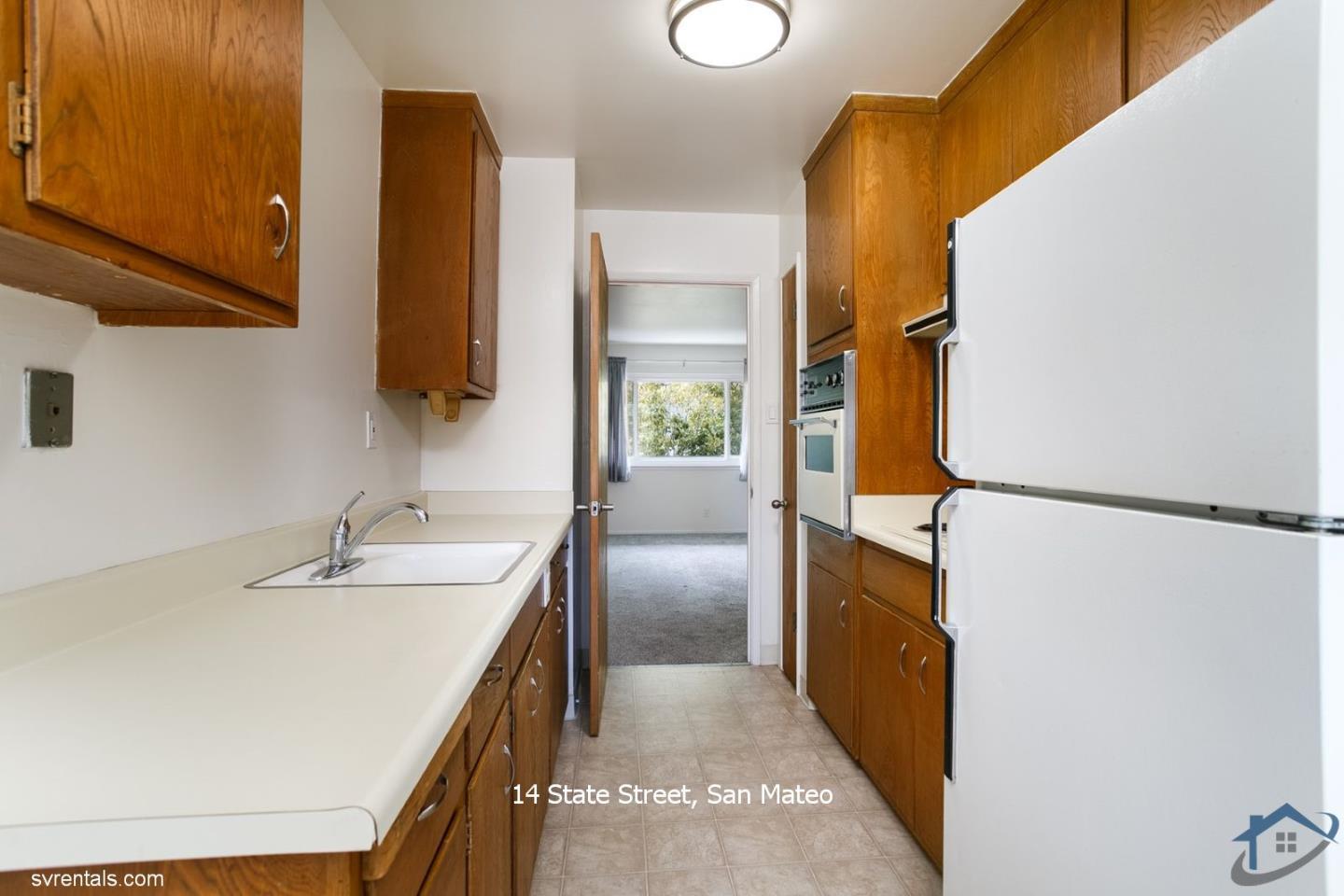 14 State Street, Unit 6 San Mateo, CA 94401 - Photo 10 of 20 a bathroom with a sink and a mirror