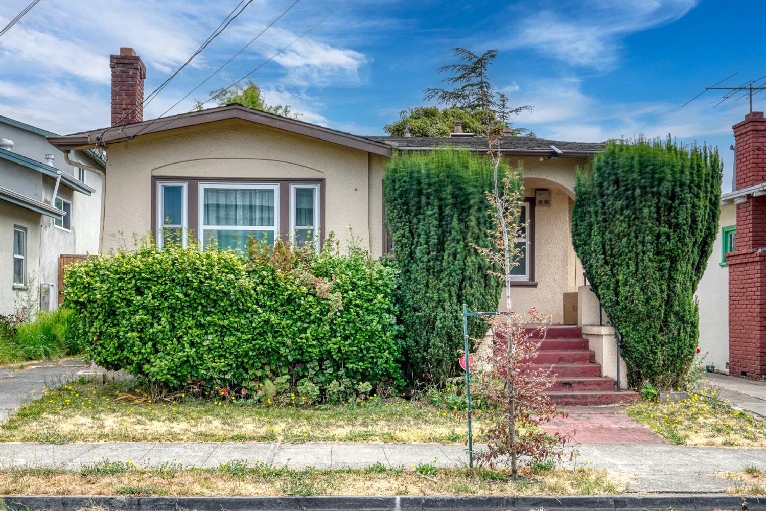 1320 67th Street Berkeley, CA 94702 - Photo 1 of 1 a front view of a house with a yard