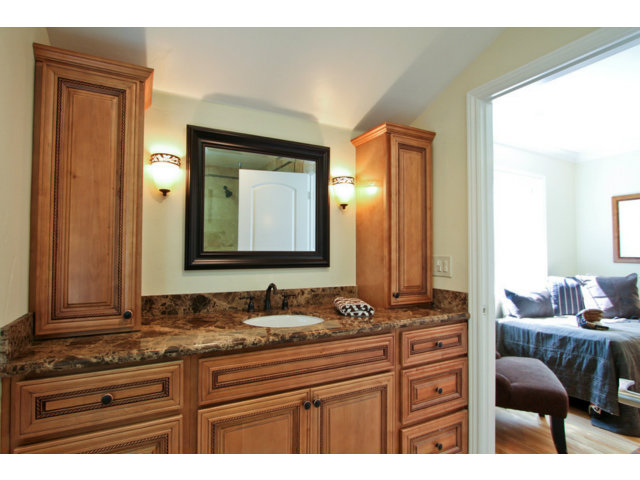 1761 Lantis Lane Los Altos, CA 94024 - Photo 11 of 19 a bathroom with a granite countertop sink and a mirror