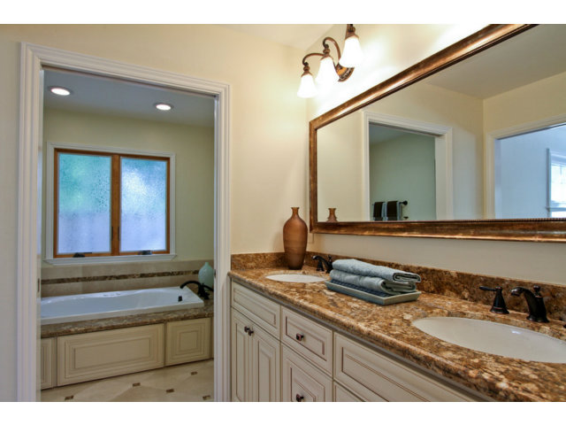 1761 Lantis Lane Los Altos, CA 94024 - Photo 14 of 19 a bathroom with a granite countertop sink and a mirror