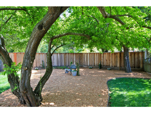 1761 Lantis Lane Los Altos, CA 94024 - Photo 19 of 19 a backyard with wooden fence and a bench