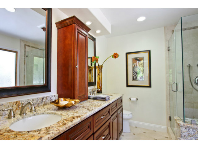 1761 Lantis Lane Los Altos, CA 94024 - Photo 9 of 19 a bathroom with a granite countertop sink mirror and a shower
