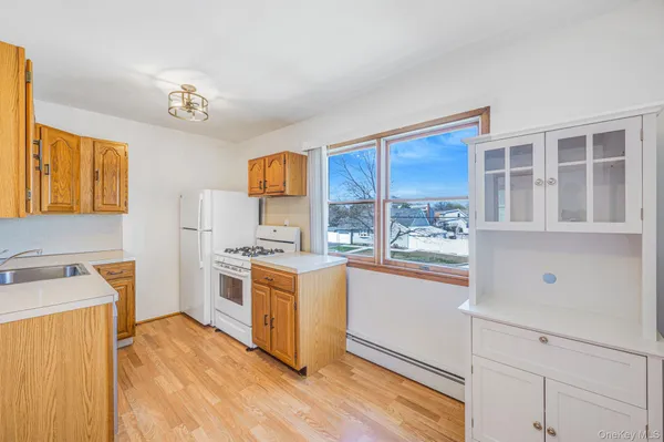 a kitchen with stainless steel appliances granite countertop a stove and a refrigerator