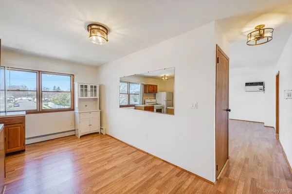 a view of a room with wooden floor and window