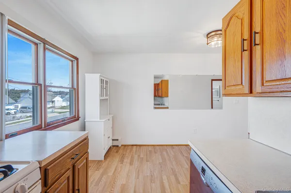 a view of a kitchen with furniture and windows