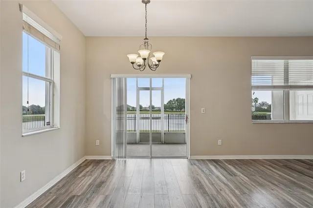 a kitchen with stainless steel appliances granite countertop a sink a stove a microwave and cabinets