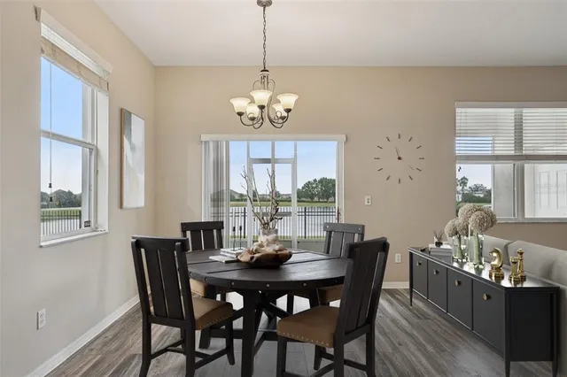 a kitchen with stainless steel appliances granite countertop a refrigerator stove and cabinets