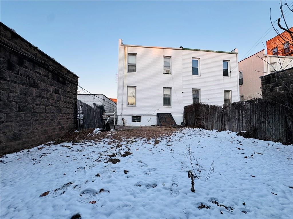 718 Bay Ridge Avenue Brooklyn, NY 11228 - Photo 6 of 6 a view of a white house with a yard