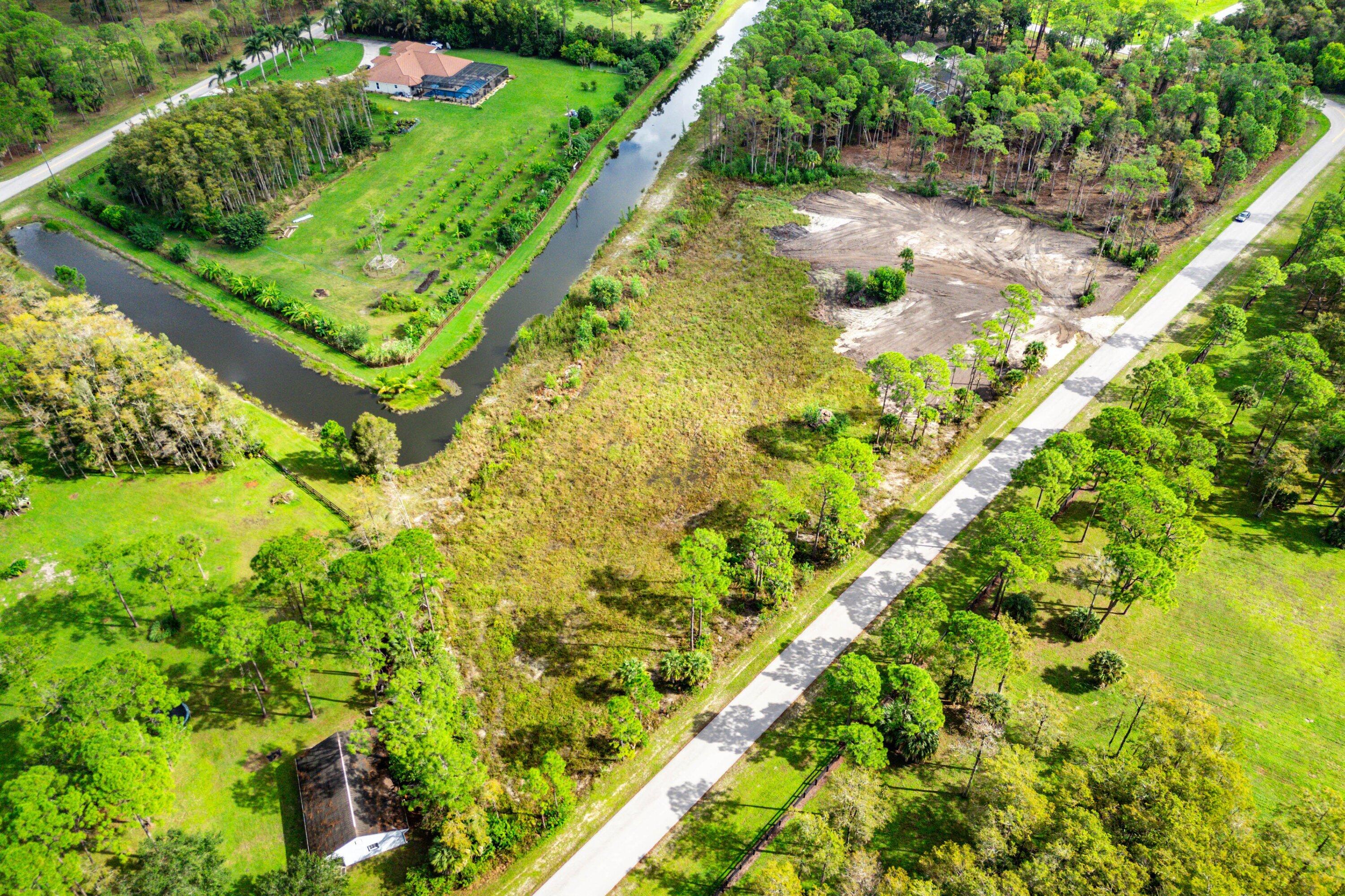 6269 Wild Orchid Trail Lake Worth, FL 33449 - Photo 4 of 12 a view of a garden