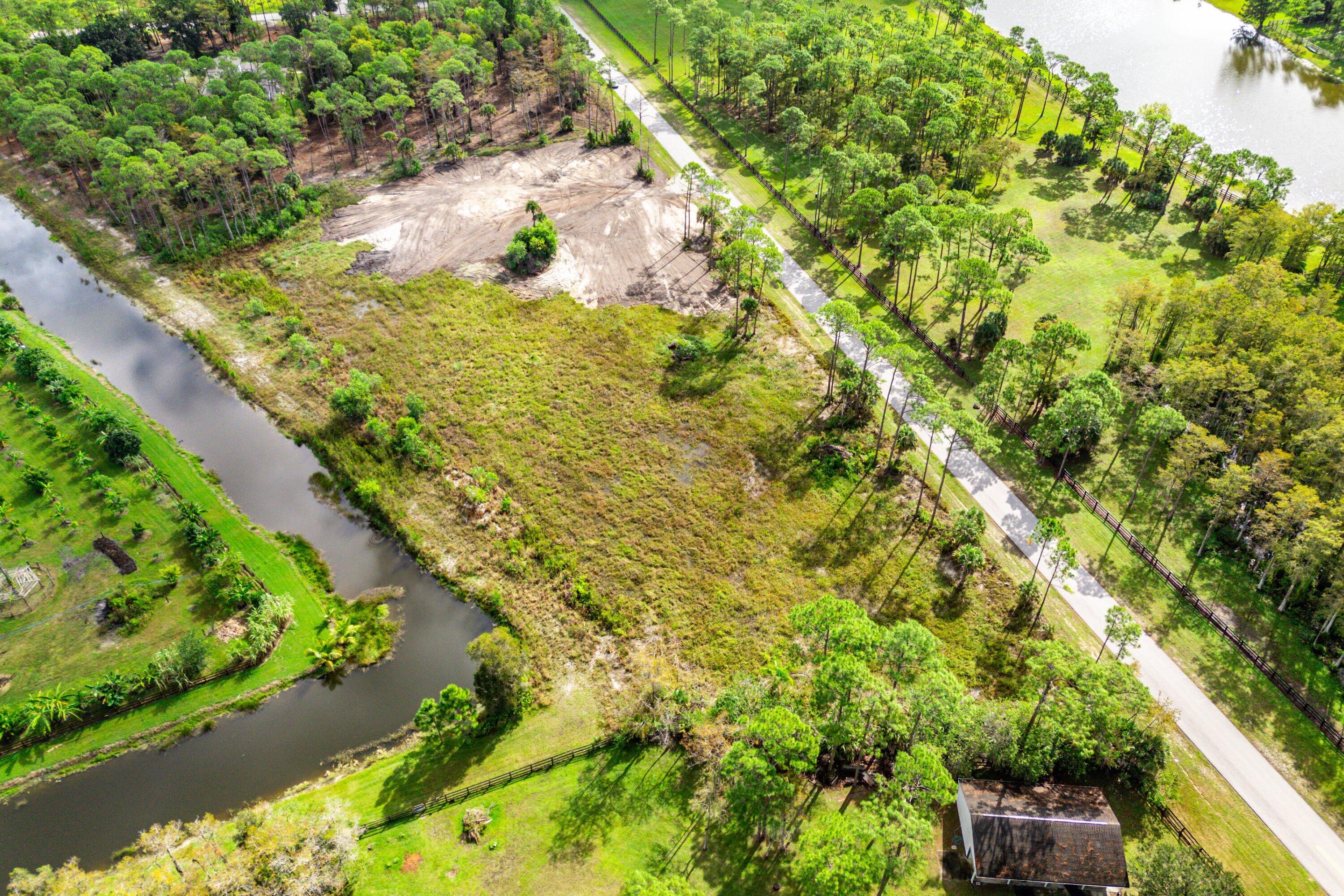 6269 Wild Orchid Trail Lake Worth, FL 33449 - Photo 6 of 12 a view of a garden