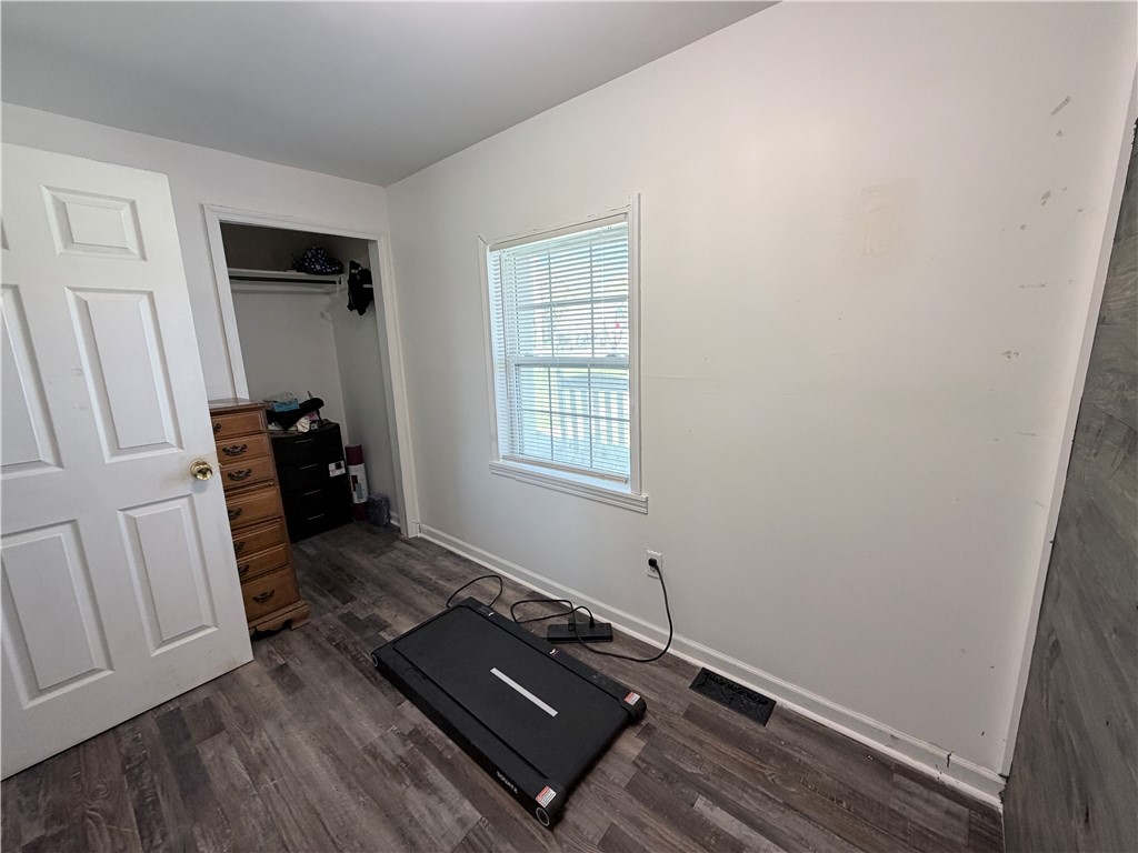 6800 Farmington Road Miamisburg, OH 45342 - Photo 13 of 32 This cozy bedroom features durable vinyl flooring and a convenient walk-in closet.
