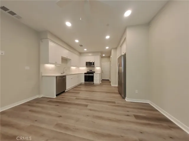 a view of kitchen with wooden floor