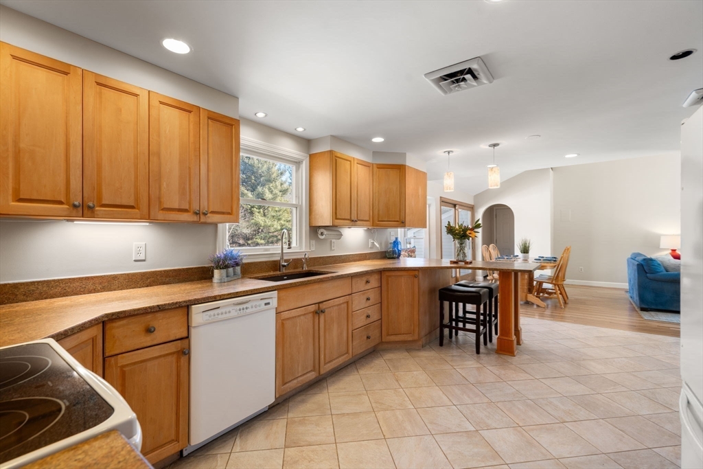 115 Victoria Road Sudbury, MA 01776 - Photo 12 of 41 a kitchen with sink cabinets and window