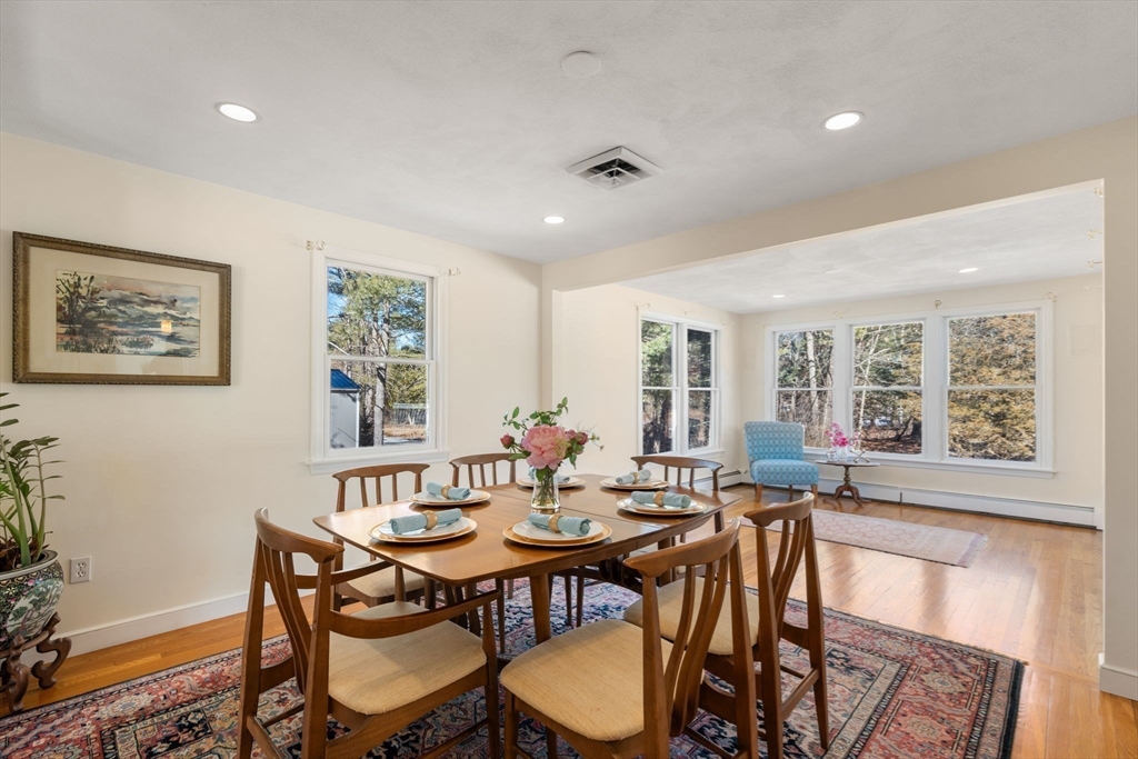 115 Victoria Road Sudbury, MA 01776 - Photo 16 of 41 a view of a dining room with furniture window and outside view