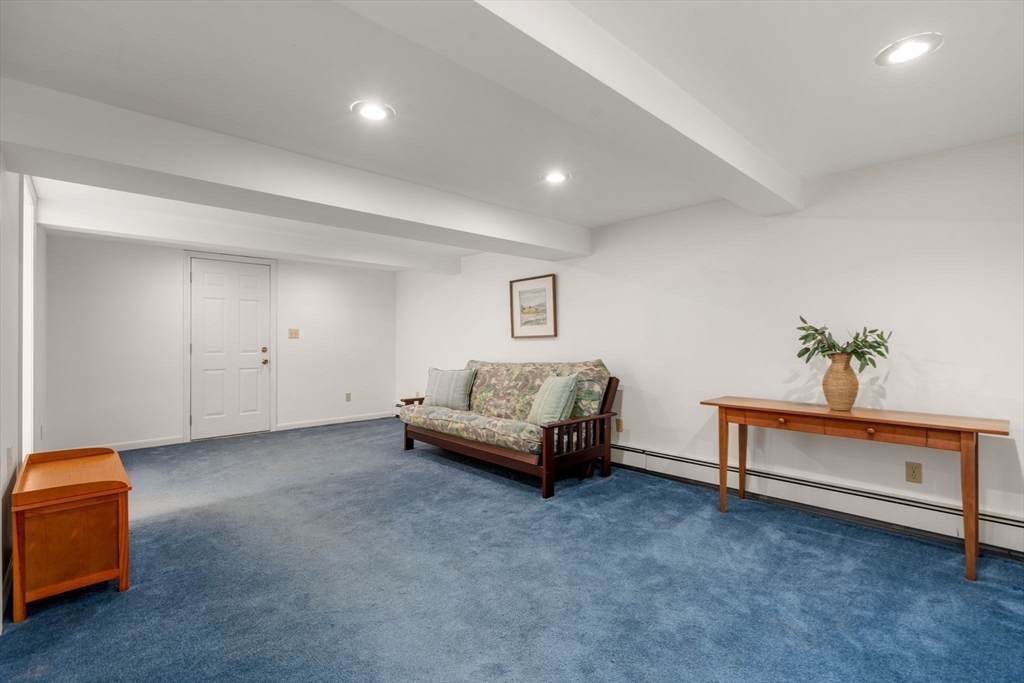 115 Victoria Road Sudbury, MA 01776 - Photo 31 of 41 a living room with furniture and a potted plant