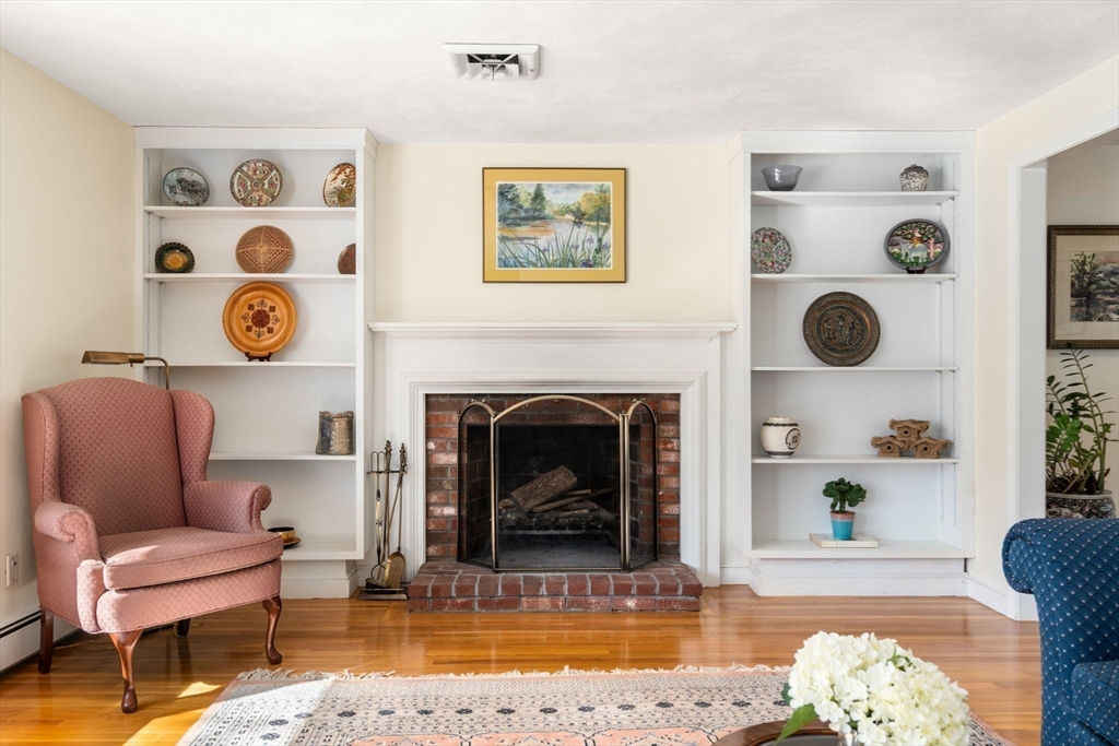 115 Victoria Road Sudbury, MA 01776 - Photo 5 of 41 a living room with furniture and a fireplace
