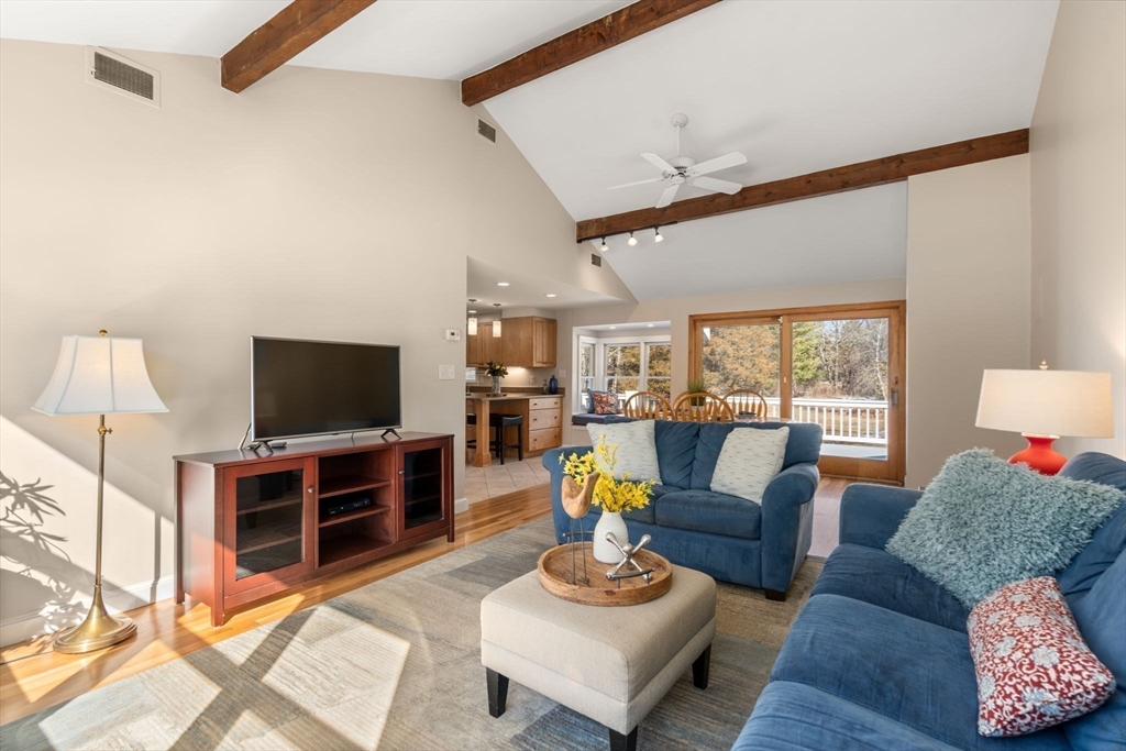 115 Victoria Road Sudbury, MA 01776 - Photo 9 of 41 a living room with furniture and a flat screen tv