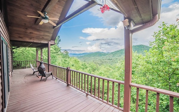 a view of a porch with wooden floor