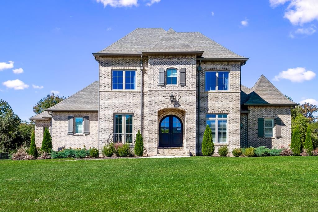 504 McCulley Road Cookeville, TN 38506 - Photo 1 of 70 a front view of a house with a garden